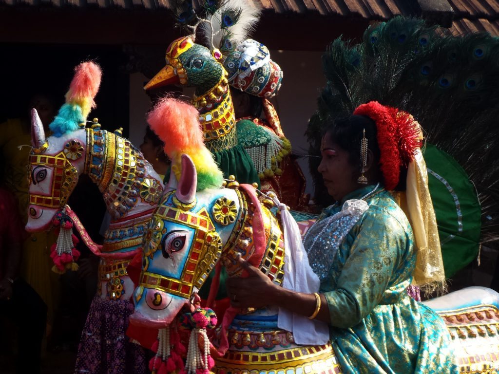 Folk dancers daning in the Poi Kal Kudhirai